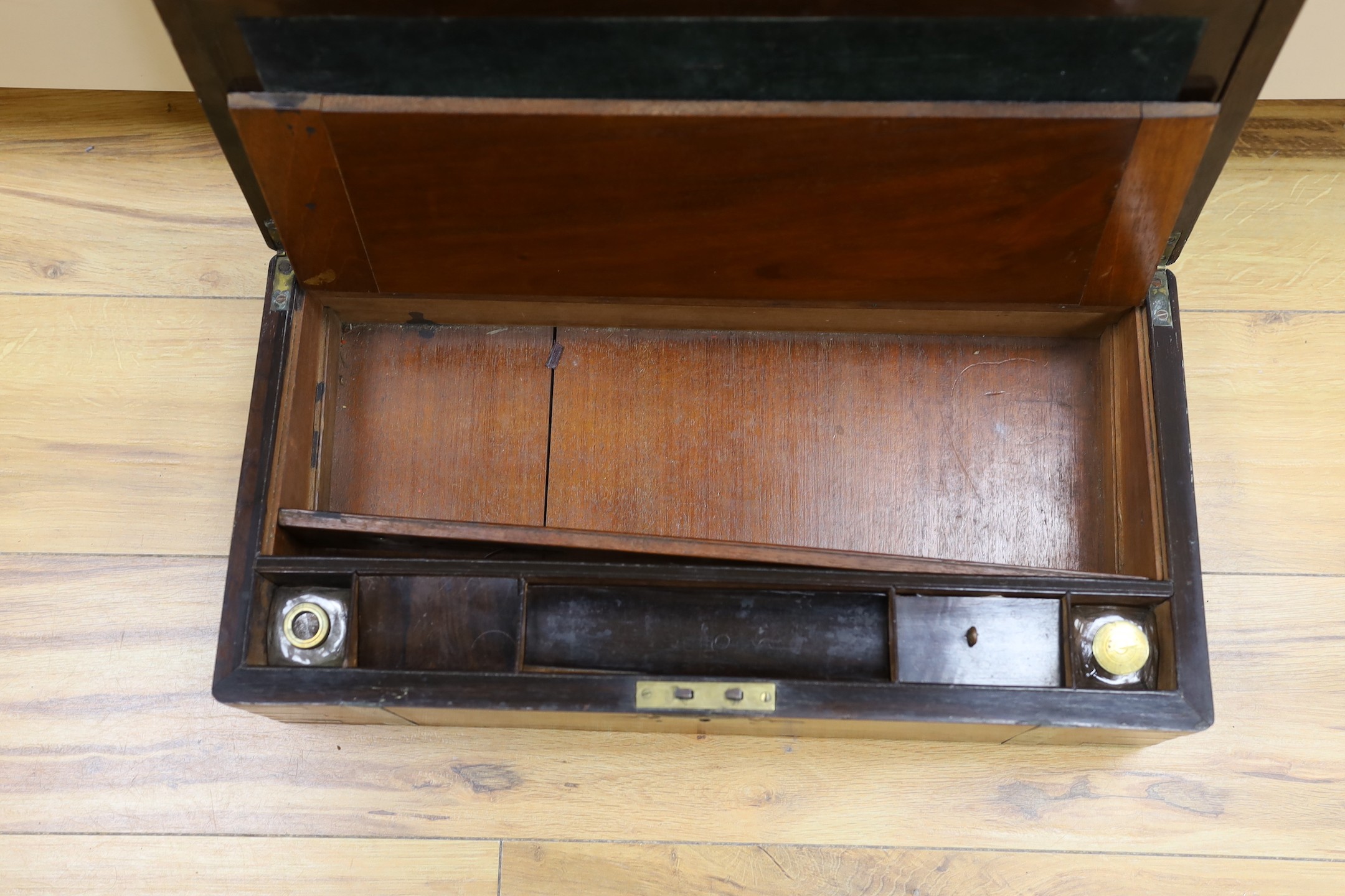 A Victorian rosewood and brass bound writing slope, 50.5 cm wide